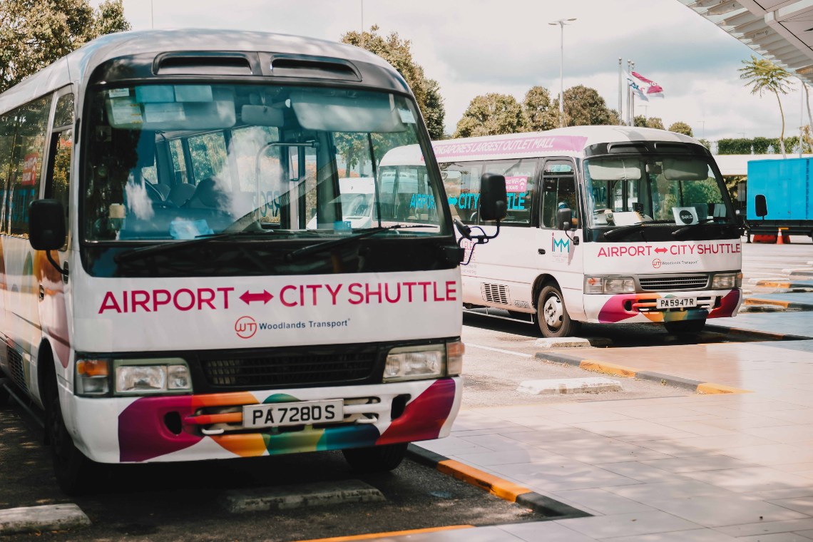City shuttle buses parked at the bus bay.